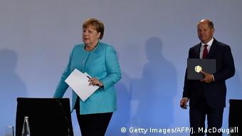 Канцлер Ангела Меркель и вице-канцлер, министр финансов Олаф Шольц на пресс-конференции 3 июня
